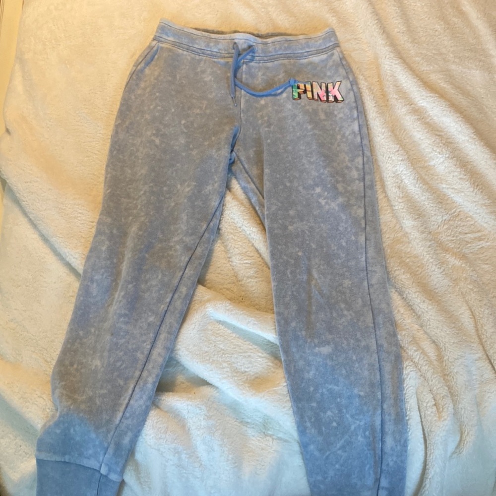 -light blue and multicolored pink logo